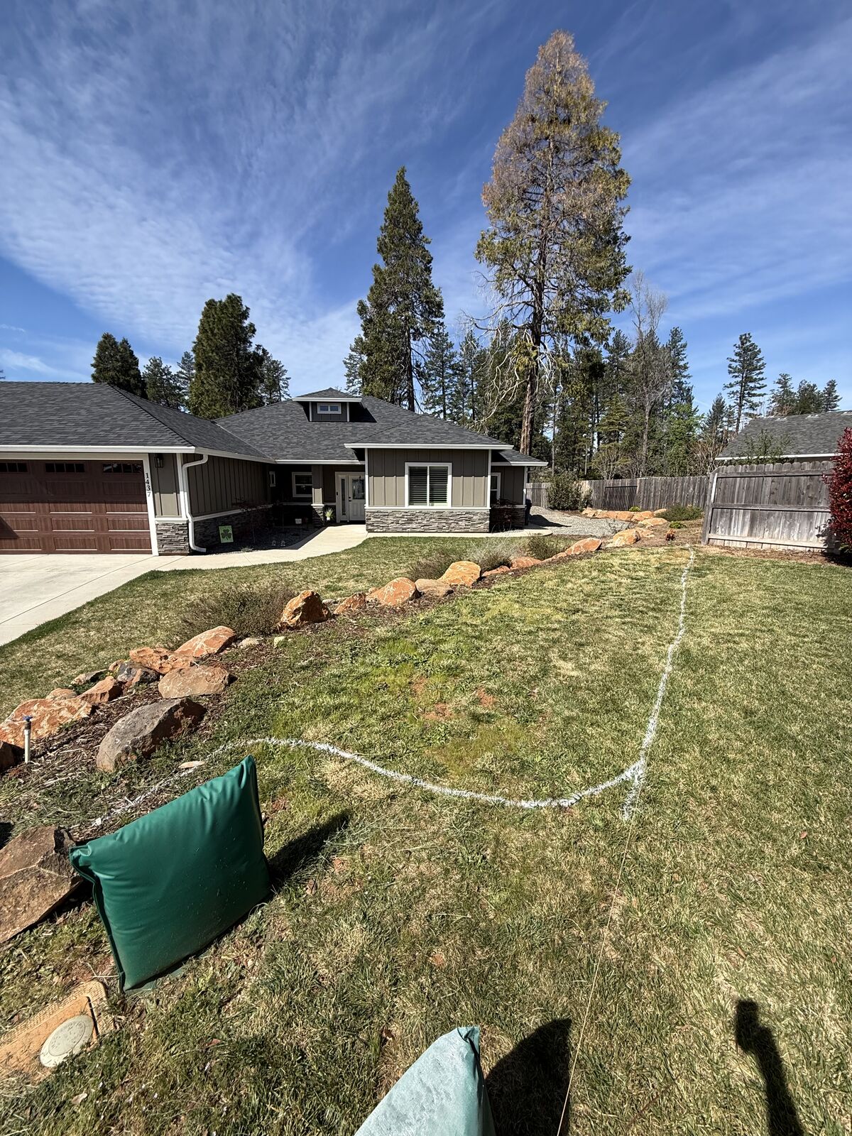 Front yard layout marked out with boulders staged before landscaping